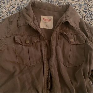 green zip up jacket